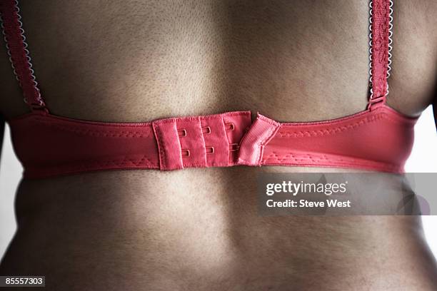 back view of woman wearing bra - too small stock pictures, royalty-free photos & images