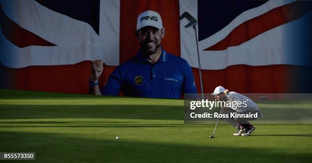 Rory McIlroy of Northern Ireland lines up his putt on the 18th green during the second round of the British Masters at Close House Golf Club on...