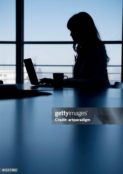 silhouette of business woman - 職場　日本 ストックフォトと画像