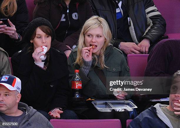 Kirsten Dunst and guest attend the Ottawa Senators versus New York Rangers game at Madison Square Garden on March 22, 2009 in New York City.