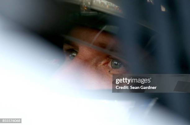 Blake Koch, driver of the LeafFilter Gutter Protection Chevrolet, sits in his car during practice for the NASCAR XFINITY Series "Use Your Melon....