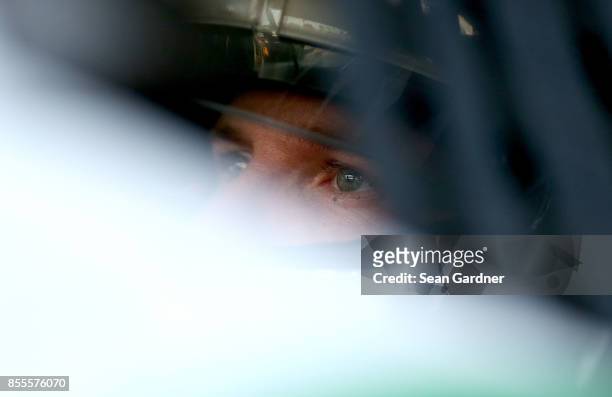 Blake Koch, driver of the LeafFilter Gutter Protection Chevrolet, sits in his car during practice for the NASCAR XFINITY Series "Use Your Melon....