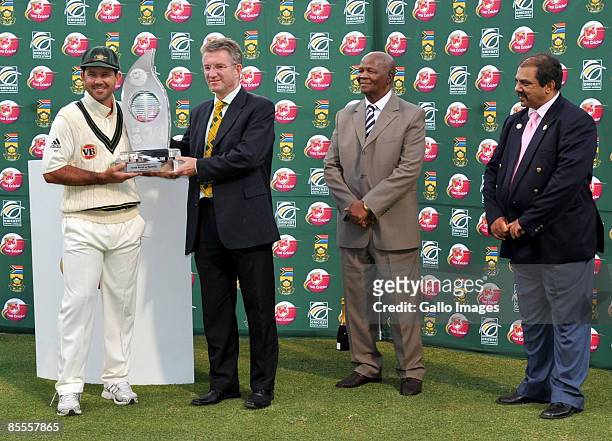 Ricky Ponting of Australia receives the series Trophy from Rob Fleming after day 4 of the 3rd test match between South Africa and Australia from...