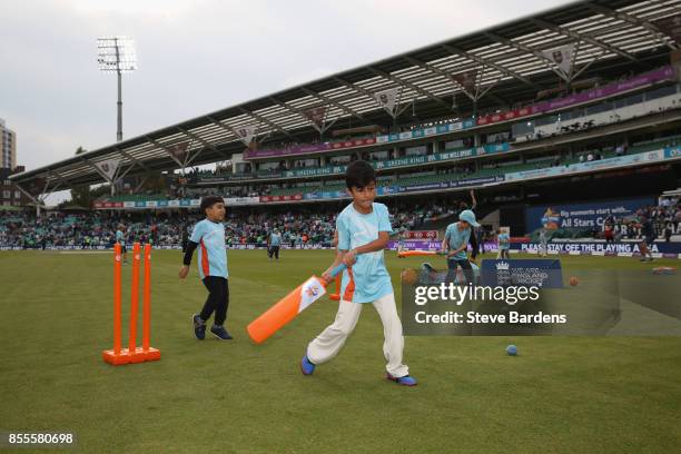 Children participate in an All Stars Cricket session during the interval at the 4th Royal London One Day International between England and West...