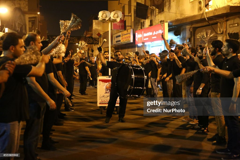 Shiite Muslims take part in a ceremony marking Ashura, which... News