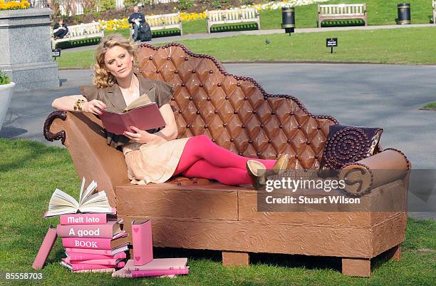 Actress Emilia Fox poses for photos on a sofa made of Galaxy chocolate to launch the Irresistable Reads campaign at Victoria Embankment Gardens on...