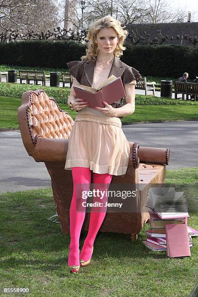 Emilia Fox poses for photos on a sofa made of chocolate to launch the Galaxy 'Irresistible Reads' campaign to give away one million free books at...