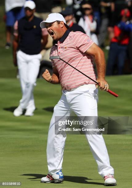 Patrick Reed of the U.S. Team celebrates on the second green during Friday four-ball matches of the Presidents Cup at Liberty National Golf Club on...