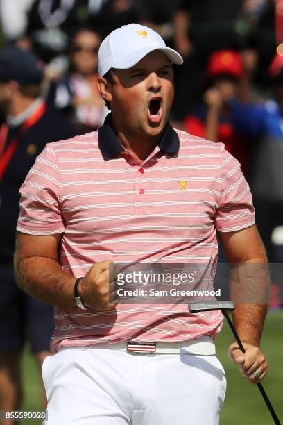 Patrick Reed of the U.S. Team celebrates on the second green during Friday four-ball matches of the Presidents Cup at Liberty National Golf Club on...