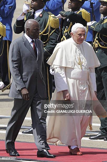 Pope Benedict XVI and Angolan President Jose Eduardo Dos Santos review an honor guard on March 23, 2009 at Luanda's 4 Fevereiro International Airport...