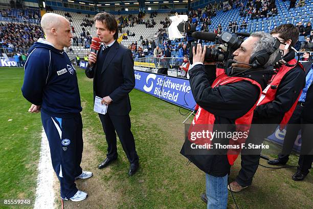 Head coach Michael Frontzeck of Bielefeld gives an interview to the media prior to the Bundesliga match between Arminia Bielefeld and VfL Wolfsburg...