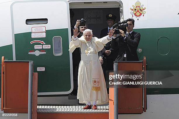 Pope Benedict XVI waves on March 23, 2009 as he boards his plane at Luanda's 4 Fevereiro International Airport at the end of his first tour of the...