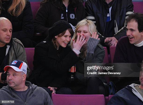 Kirsten Dunst and guest attend the Ottawa Senators versus New York Rangers game at Madison Square Garden on March 22, 2009 in New York City.