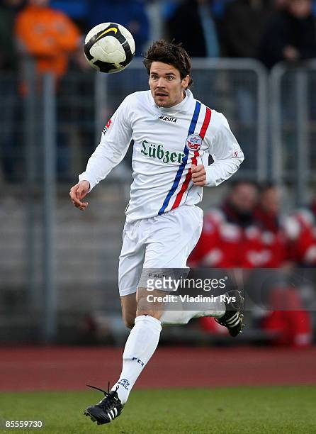Heath Pearce of Rostock runs with the ball during the second Bundesliga match at the Oberwerth stadium on March 20, 2009 in Koblenz, Germany.