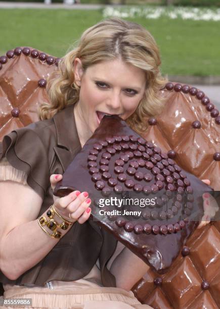 Emilia Fox poses for photos on a sofa made of chocolate to launch the Galaxy 'Irresistible Reads' campaign to give away one million free books at...
