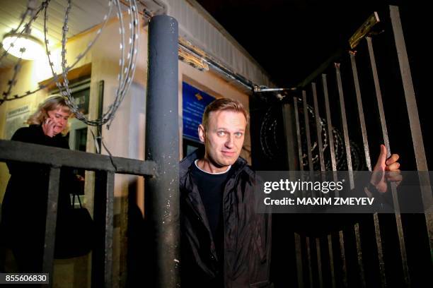 Russian opposition leader Alexei Navalny leaves a police station in Moscow on September 29, 2017. - Alexei Navalny, who was detained earlier the day...
