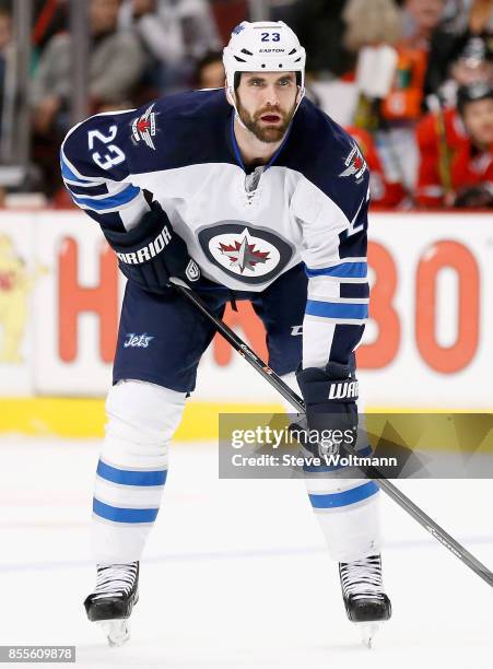 Jay Harrison of the Winnipeg Jets plays in a game against the Chicago Blackhawks at the United Center on December 23, 2014 in Chicago, Illinois.