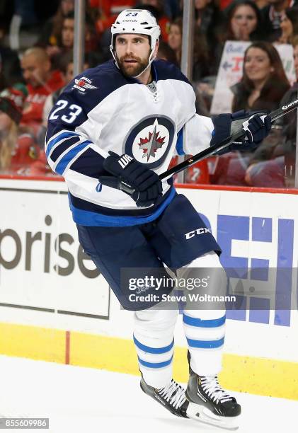 Jay Harrison of the Winnipeg Jets plays in a game against the Chicago Blackhawks at the United Center on December 23, 2014 in Chicago, Illinois.