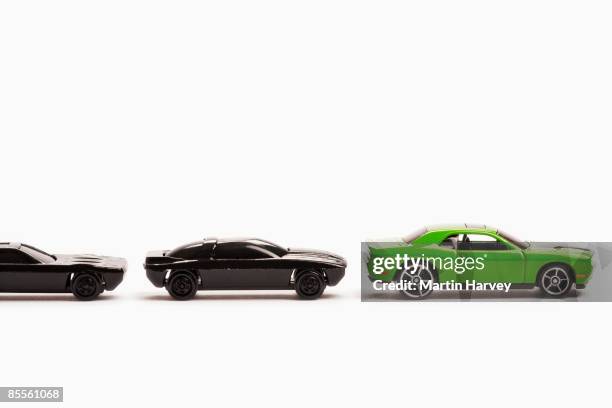 green and black toy cars. - toy car foto e immagini stock