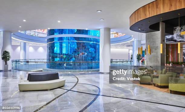 new shopping mall in moscow with the biggest aquarium in the centre - shoppingcenter stock-fotos und bilder