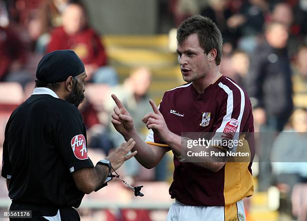Mark Hughes of Northampton Town makes a point to Referee Jarnail Singh during the Coca Cola League One Match between Northampton Town and Stockport...