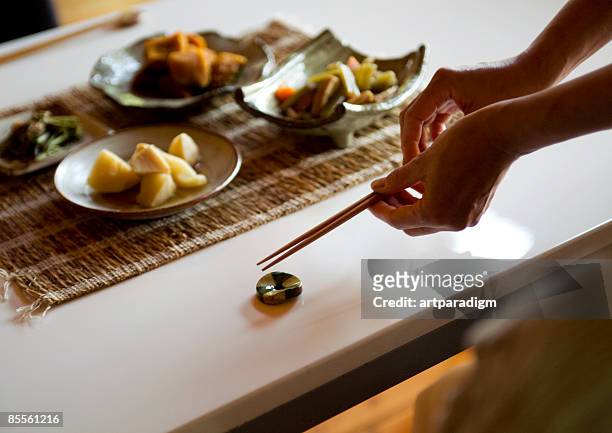 woman preparing for a meal - 箸 �ストックフォトと画像