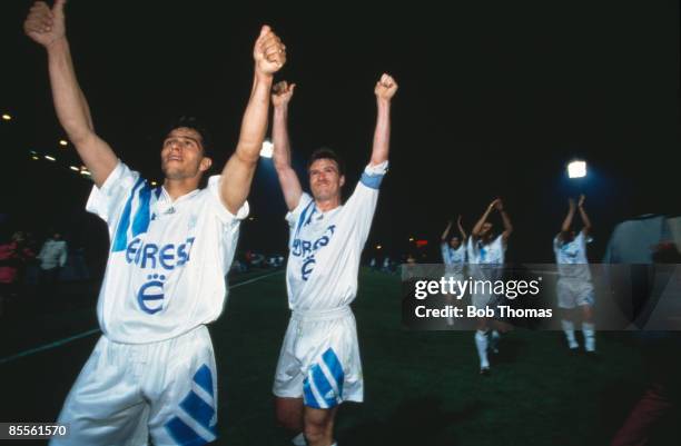 French footballers Jean-Jacques Eydelie and Didier Deschamps celebrate a 0-1 victory after a match between Valenciennes and Olympique de Marseille,...