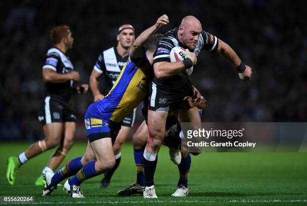 Gareth Ellis of Hull FC is tackled by Danny McGuire of Leeds during the Betfred Super League semi final between Leeds Rhinos and Hull FC at...
