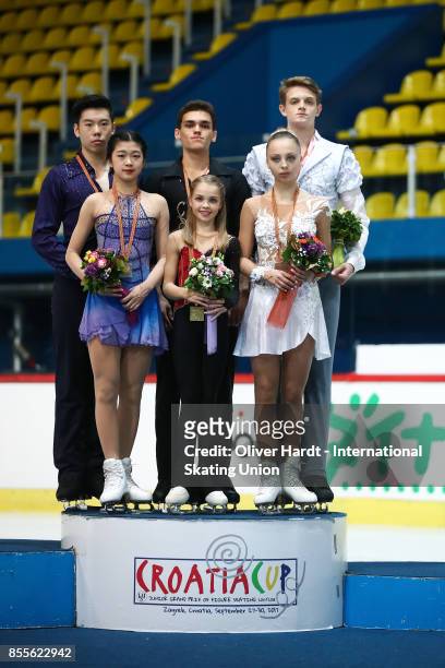 Yumeng Gao and Zhong Xie of China with the silver medal, Polina Kostiukovich and Dmitrii Ialin of Russia with the gold medal and Aleksnadra Boikova...