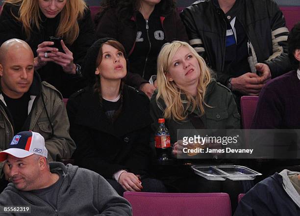 Kirsten Dunst and guest attend the Ottawa Senators versus New York Rangers game at Madison Square Garden on March 22, 2009 in New York City.