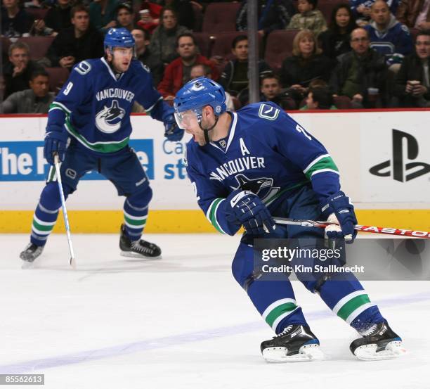 Mattias Ohlund of the Vancouver Canucks gets vocal with line mate Taylor Pyatt during their game against the St. Louis Blues at General Motors Place...