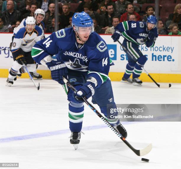 Alex Burrows of the Vancouver Canucks on a beakaway during game action against the St. Louis Blues at General Motors Place on March 19, 2009 in...