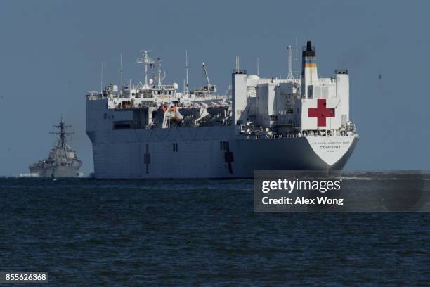 Comfort, the naval hospital ship, leaves the harbor as USS McFaul is seen in the background September 29, 2017 in Hampton, Virginia. The USNS Comfort...