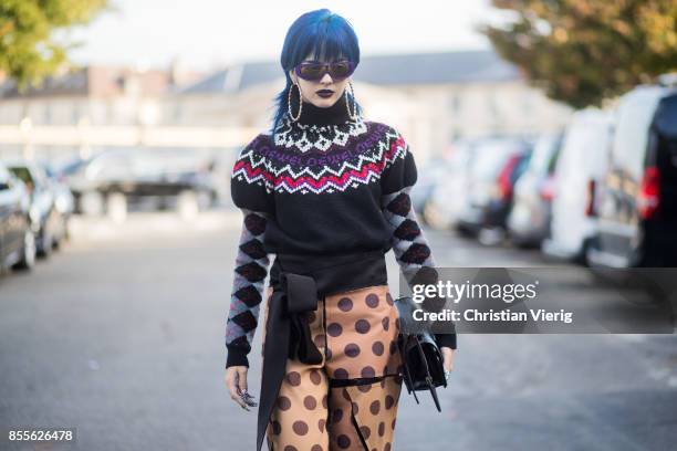 Sita Abellan wearing knit, pants with dot print is seen outside Loewe during Paris Fashion Week Spring/Summer 2018 on September 29, 2017 in Paris,...