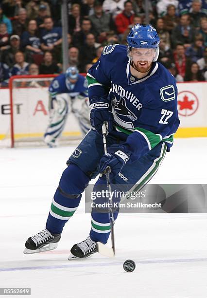 Daniel Sedin of the Vancouver Canucks controls the puck during the game against the St. Louis Blues at General Motors Place on March 19, 2009 in...