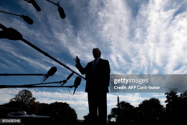 President Donald Trump speaks to the media prior to boarding Marine One and departing from the South Lawn of the White House in Washington, DC,...