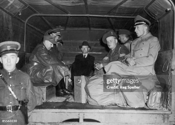 Captured German generals and a civilian arriving at Euston Station, London, where they will be put on a train to an internment camp, 4th June 1945.