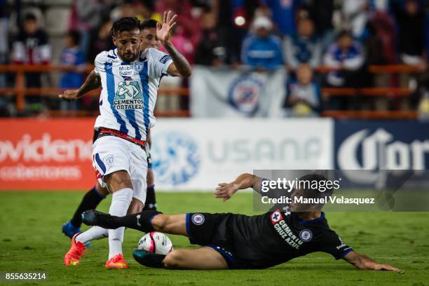 Robert Herrera of Pachuca struggles for the ball with Francisco Silva of Cruz Azul during the 11th round match between Pachuca and Cruz Azul as part...