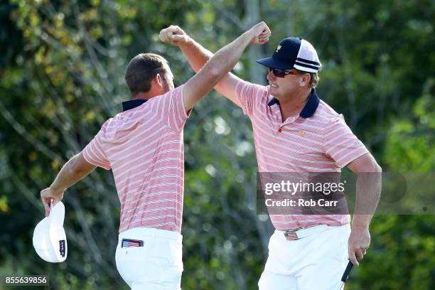 Kevin Chappell and Charlie Hoffman of the U.S. Team celebrate on the 13th green after defeating Anirban Lahiri of India and the International Team...