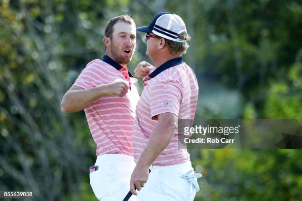 Kevin Chappell and Charlie Hoffman of the U.S. Team celebrate on the 13th green after defeating Anirban Lahiri of India and the International Team...