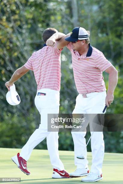 Kevin Chappell and Charlie Hoffman of the U.S. Team celebrate on the 13th green after defeating Anirban Lahiri of India and the International Team...