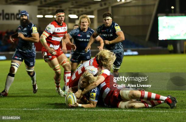 Faf de Klerk of Sale Sharks dives over the line to score a try during the Aviva Premiership match between Sale Sharks and Gloucester Rugby at AJ Bell...