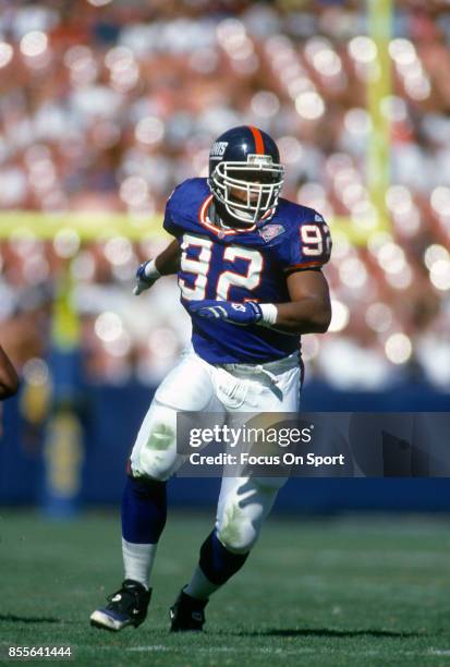 Michael Strahan of the New York Giants in action against the Los Angeles Rams during an NFL football game October 16, 1994 at Anaheim Stadium in...