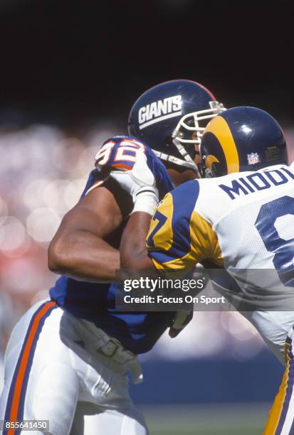 Michael Strahan of the New York Giants in action against the Los Angeles Rams during an NFL football game October 16, 1994 at Anaheim Stadium in...