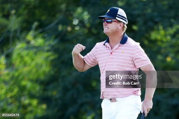 Charlie Hoffman of the U.S. Team celebrates on the 13th green after he and Kevin Chappell of the U.S. Team defeated Anirban Lahiri of India and the...