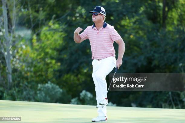 Charlie Hoffman of the U.S. Team celebrates on the 13th green after he and Kevin Chappell of the U.S. Team defeated Anirban Lahiri of India and the...