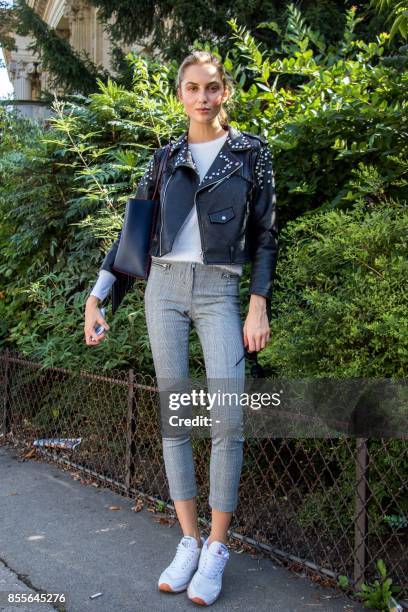 Former miss Slovakia 2016 and model Kristina Cincurova poses as she arrives prior to the Issey Miyake women's 2018 Spring/Summer ready-to-wear...