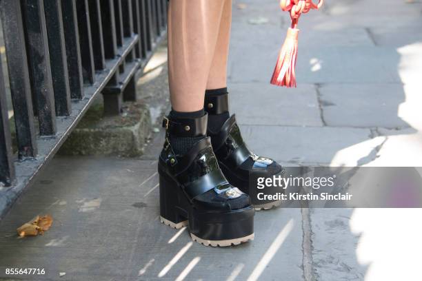Buying manager women's design wear Selfridges Jeannie Lee wears Sacai shoes on day 2 of London Womens Fashion Week Spring/Summer 2018, on September...