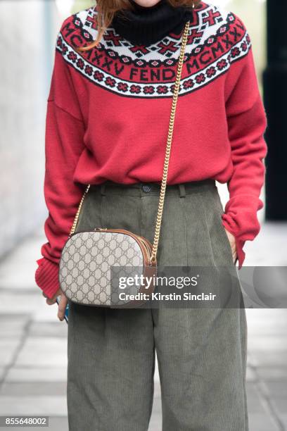 Head of fashion at Italian Grazia Sara Moscini wears a Fendi sweater, Gucci bag and Twins Florence trousers on day 2 of London Womens Fashion Week...