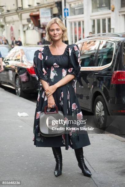 Fashion blogger Pandora Sykes wears a Rejina Pyo dress, Mulberry bag and vintage boots on day 2 of London Womens Fashion Week Spring/Summer 2018, on...